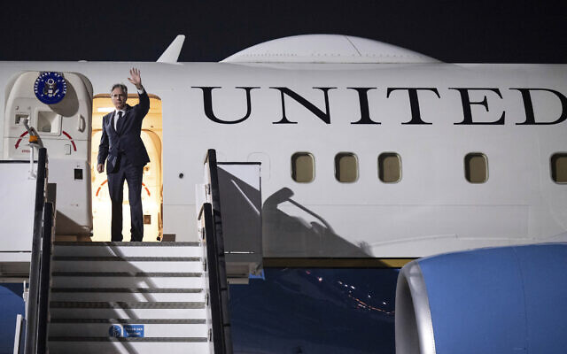US Secretary of State Antony Blinken waves prior to departure from Al Maktoum International Airport in Dubai, United Arab Emorates, Friday, Dec. 1, 2023. (Saul Loeb/Pool Photo via AP)