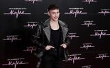 Olly Alexander poses for photographers at the Royal Albert Hall, in London, December 1, 2023. (Millie Turner/Invision/AP)