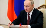 Russian President Vladimir Putin holds the annual meeting of the Presidential Council for Civil Society and Human Rights, via video conference, in Moscow, Russia, December 4, 2023. (Mikhail Klimentyev, Sputnik, Kremlin Pool Photo via AP)
