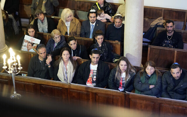 Relatives of Israeli hostages Eli and Yossi Sharabi, Tsachi Idan and Idan Shtivi attend a ceremony and a prayer for their liberation at the synagogue in Lisbon, Dec. 5, 2023 (AP Photo/Armando Franca) Relatives of Israeli hostages Eli and Yossi Sharabi, Tsachi Idan and Idan Shtivi attend a ceremony and a prayer for their liberation at the synagogue in Lisbon, Dec. 5, 2023 (AP Photo/Armando Franca)