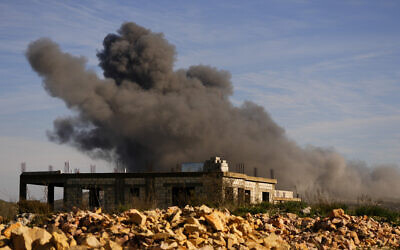 Black smoke rises from an Israeli airstrike on the outskirts of Yaroun, a Lebanese border village with Israel, in south Lebanon, December 10, 2023. (AP Photo/Hassan Ammar)