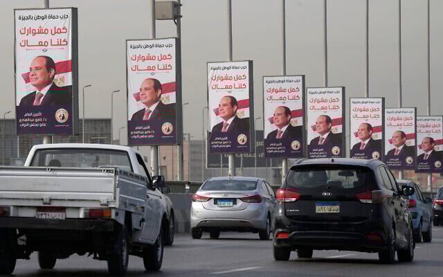 Vehicles pass near banners supporting Egyptian President Abdel Fattah el-Sissi for the presidential elections, in Cairo, Egypt, Sunday, Dec. 10, 2023. (AP Photo/Amr Nabil) Vehicles pass near banners supporting Egyptian President Abdel Fattah el-Sissi for the presidential elections, in Cairo, Egypt, Sunday, Dec. 10, 2023. (AP Photo/Amr Nabil)