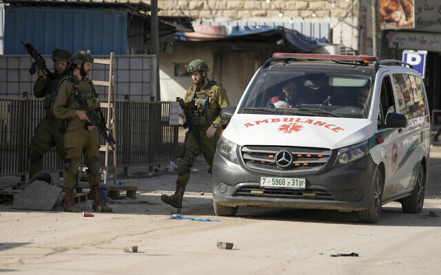 Israeli soldiers are seen during an army operation in the Jenin camp, West Bank, December 12, 2023. (AP/Majdi Mohammed) Israeli soldiers are seen during an army operation in the Jenin camp, West Bank, December 12, 2023. (AP/Majdi Mohammed)