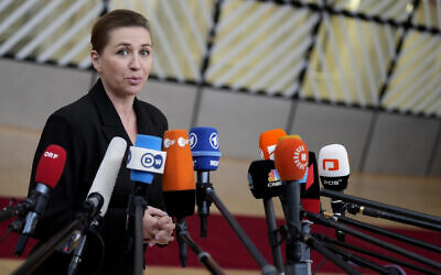 Denmark's Prime Minister Mette Frederiksen speaks with the media as she arrives for an EU summit at the European Council building in Brussels, Thursday, December 14, 2023. (AP Photo/Virginia Mayo)