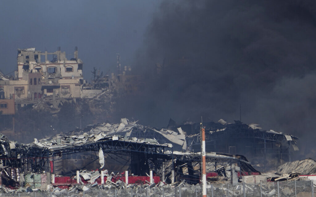 Smoke rises following an Israeli strike in the Gaza Strip, as seen from southern Israel, Dec. 16, 2023. (AP Photo/Ariel Schalit)