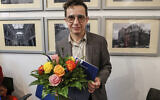 Russian American writer Masha Gessen  after receiving the Hannah Arendt Prize, in event room F61 in Bremen, Germany, Saturday, December 16, 2023. (Focke Strangmann/dpa via AP)