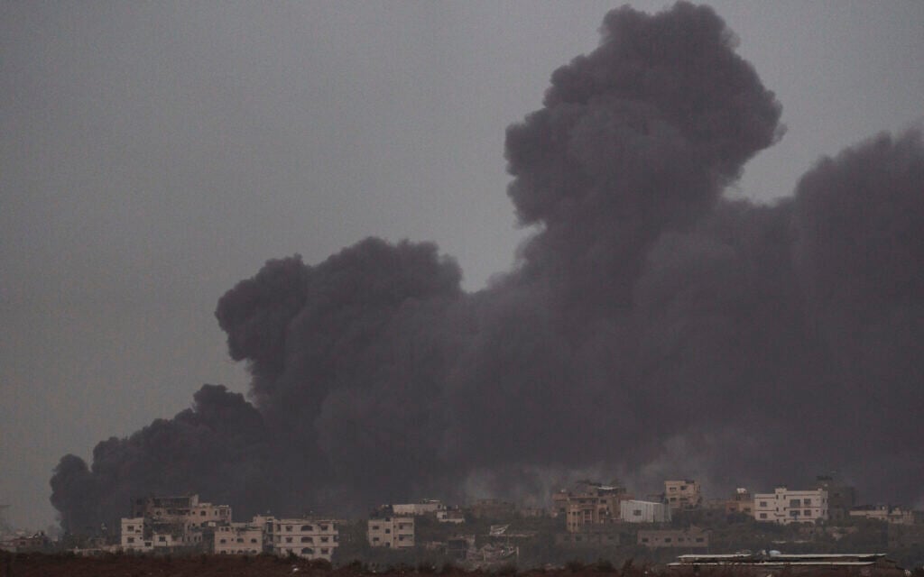 Smoke rises to the sky after an explosion in Gaza Strip as seen from Southern Israel, December 23, 2023. (AP Photo/Leo Correa)