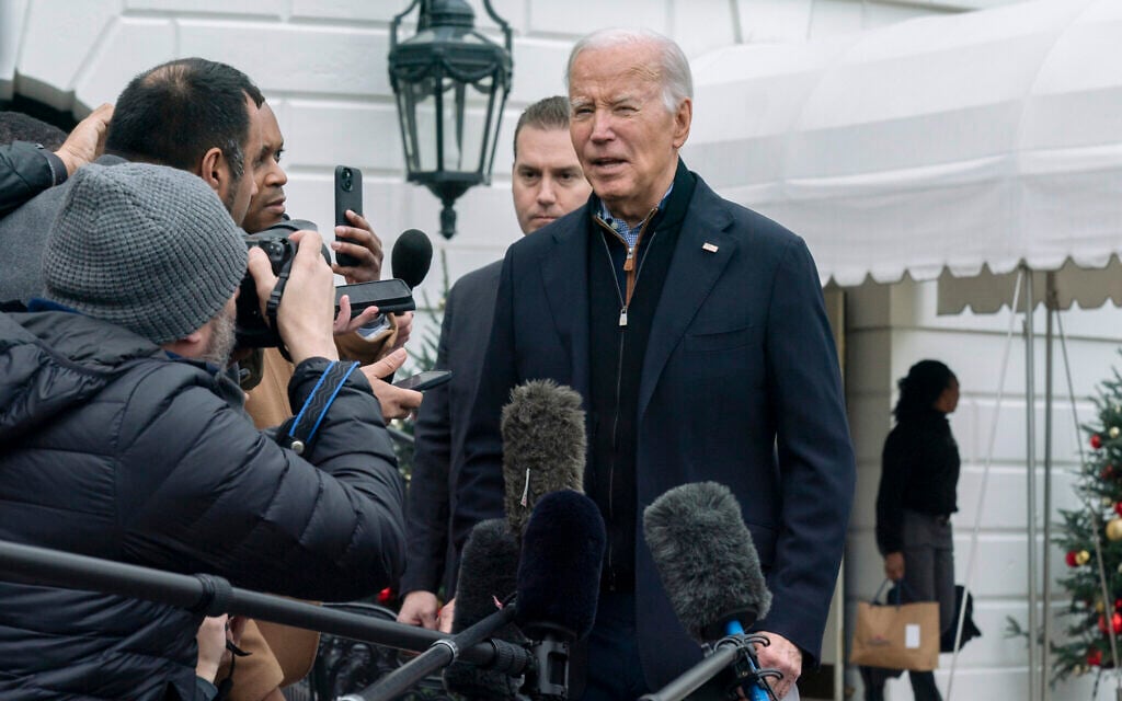 US President Joe Biden speaks to members of the media as he leaves the White House to spend the Christmas holiday with his family at Camp David presidential retreat, near Thurmont, Maryland, December 23, 2023. (AP Photo/Manuel Balce Ceneta)