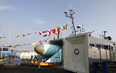 In this picture released by the official website of the Iranian Army on December 24, 2023, a missile system is displayed in an unveiling ceremony at a naval base near the Indian Ocean in the southern Iranian port of Konarak, some 850 miles (1,400 kilometers) southeast of the capital, Tehran, Iran. (Iranian Army via AP)