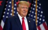 Former US president Donald Trump speaks during a commit to caucus rally, Dec. 19, 2023, in Waterloo, Iowa (AP Photo/Charlie Neibergall)