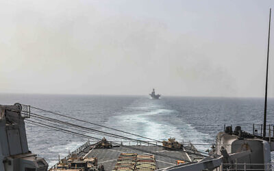 In this image provided by the US Navy, the amphibious dock landing ship USS Carter Hall and amphibious assault ship USS Bataan transit the Bab al-Mandeb strait on August 9, 2023. (Mass Communications Spc. 2nd Class Moises Sandoval/US Navy via AP)