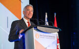 Philanthropist Sylvan Adams announcing a $100 million donation to Ben-Gurion University of the Negev, at an event in Toronto, Canada, on December 3, 2023. (Liora Kogan/Courtesy)