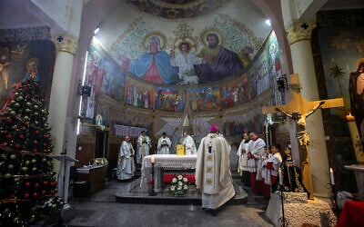 File: Apostolic Administrator of the Latin Church in the Holy land Pierbattista Pizzaballa, leads a mass to Gaza Strip Palestinian Christian worshipers in the Roman Catholic Holy Family Church during the start of the Christmas holiday, in Gaza City, on December 19, 2021. (Atia Mohammed/Flash90)