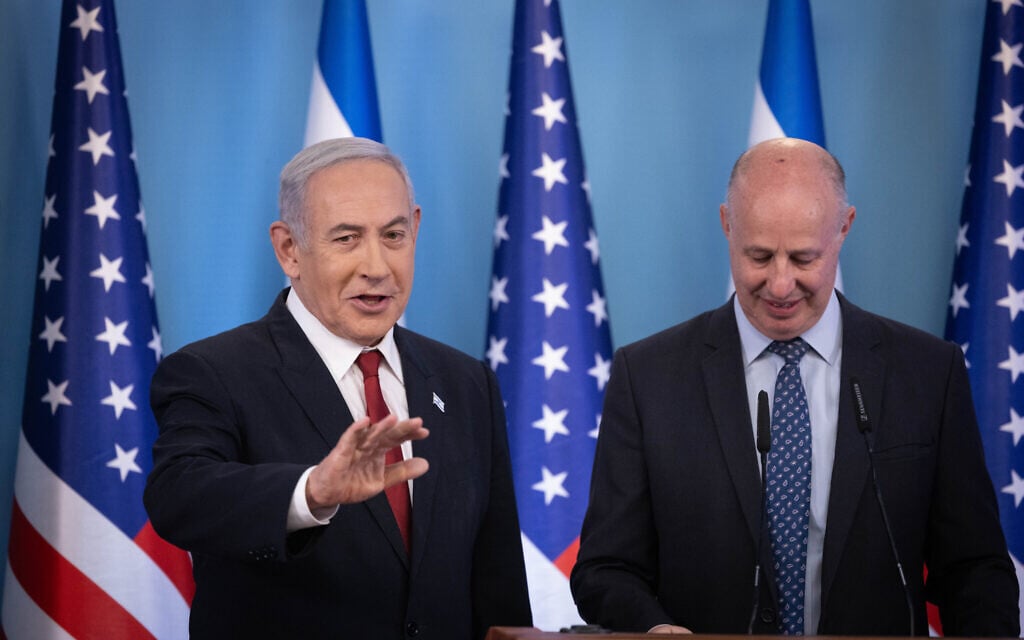 Prime Minister Benjamin Netanyahu with National Security Adviser Tzachi Hanegbi at a press conference after the US allowed Israel into its visa-waiver program, at the Prime Minister's Office in Jerusalem, on September 28, 2023. (Chaim Goldberg/Flash90)