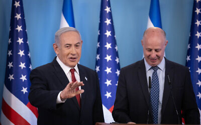Prime Minister Benjamin Netanyahu with National Security Adviser Tzachi Hanegbi at a press conference after the US allowed Israel into its visa-waiver program, at the Prime Minister's Office in Jerusalem, on September 28, 2023. (Chaim Goldberg/Flash90)
