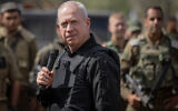 Defense Minister Yoav Gallant speaks with soldiers near the Gaza border, October 19, 2023. (Chaim Goldberg/Flash90)