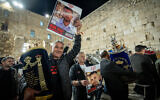 Families of Hamas hostages dance at the Western Wall on November 21, 2023 with two new Torah scrolls dedicated to the return of the hostages and in memory of those killed on October 7 (Photo by Yonatan Sindel/Flash90)