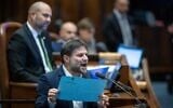Finance Minister Bezalel Smotrich speaks during a Knesset plenum session, Jerusalem, December 3, 2023. (Yonatan Sindel/Flash90)