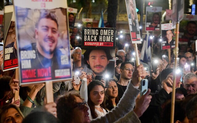 Israelis attend a rally calling for the release of Israelis held by Hamas terrorists in Gaza at "Hostages Square" in Tel Aviv, December 9, 2023. (Avshalom Sassoni/Flash90) Israelis attend a rally calling for the release of Israelis held by Hamas terrorists in Gaza at "Hostages Square" in Tel Aviv, December 9, 2023. (Avshalom Sassoni/Flash90)