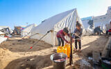 A temporary tent camp set up for Palestinians who were evacuated from their homes in Khan Younis on December 11, 2023 (Atia Mohammed/Flash90)