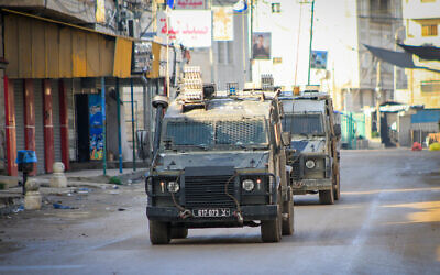 Israeli soldiers conduct a military raid in the West Bank city of Jenin, December 12, 2023. (Nasser Ishtayeh/Flash90)