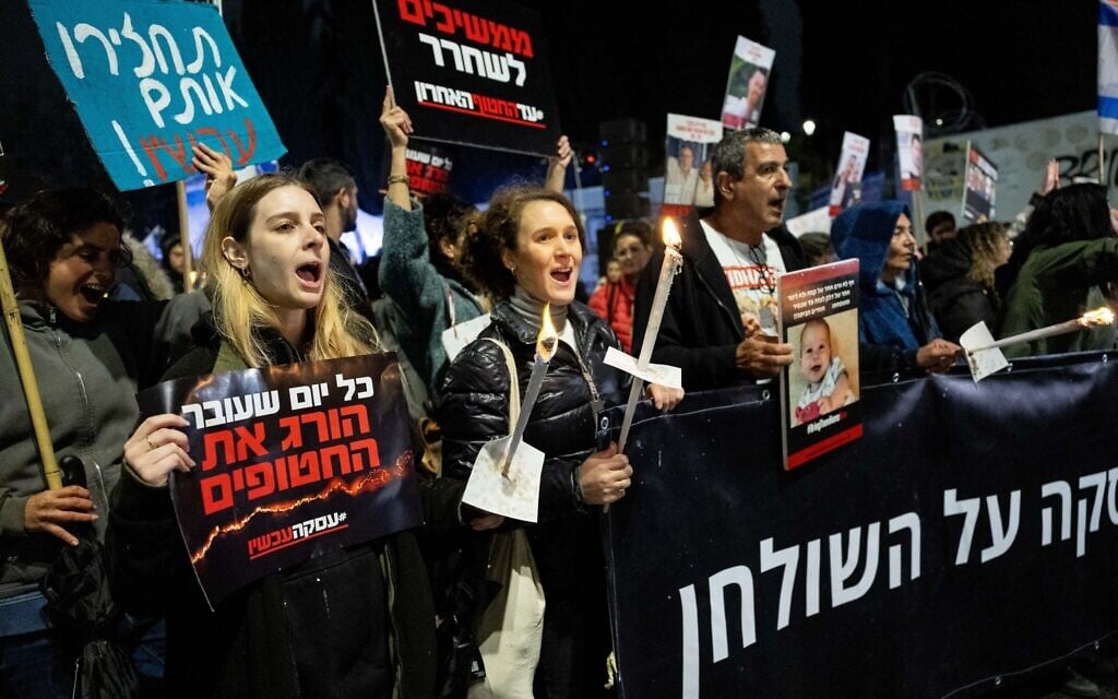 Families of hostages held in Gaza march to the Prime Minister's Office and the Knesset in Jerusalem on December 12, 2023, demanding a resumption of negotiations. (Yonatan Sindel/Flash90)