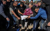 Family and friends of Samer Fouad Al-Talalka mourn and bury him in Hura, southern Israel, on December 16, 2023. He was accidentally killed in Gaza on December 15, 2023, by IDF forces after being held captive by Hamas. (Flash90)