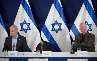 War cabinet minister Benny Gantz (right) with Prime Minister Benjamin Netanyahu during a press conference at the Defense Ministry, in Tel Aviv. December 16, 2023. (Noam Revkin Fenton/Flash90)