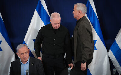 Prime Minister Benjamin Netanyahu, Defense Minister Yoav Gallant, and Minister Benny Gantz attend a press conference at the Defense Ministry, in Tel Aviv. December 16, 2023. (Noam Revkin Fenton/Flash90)