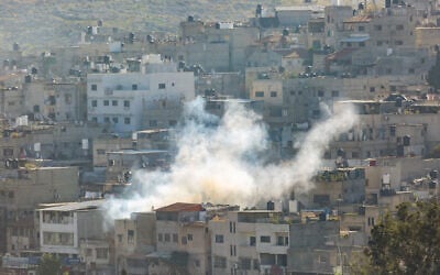 File: Smoke rises during an Israeli military raid in Tulkarem, in the West Bank, December 17, 2023. (Nasser Ishtayeh/Flash90)