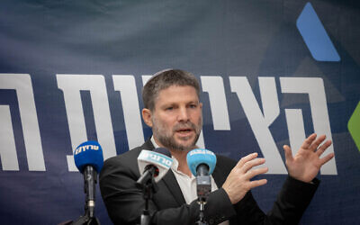 Finance minister and head of the Religious Zionist party, Bezalel Smotrich leads a faction meeting at the Knesset in Jerusalem, December 18, 2023. (Chaim Goldberg/ Flash90)