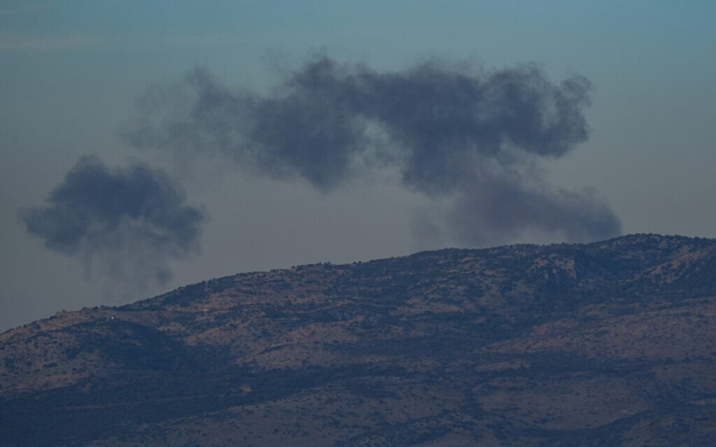 Smoke rises after rockets were fired from Lebanon into Israel, in the Mount Dov area, December 20, 2023. (Ayal Margolini/Flash90)