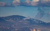 Smoke rises during an exchange of fire between the IDF and terrorists from the Hezbollah organization on the border between Israel and Lebanon, December 25, 2023. (Ayal Margolin/Flash90)
