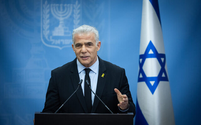 Opposition Leader Yair Lapid leads a Yesh Atid faction meeting at the Knesset, December 25, 2023. (Yonatan Sindel/Flash90)