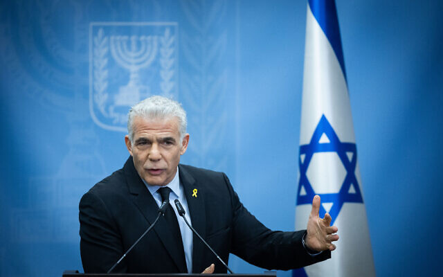 Opposition Leader Yair Lapid leads a Yesh Atid party faction meeting at the Knesset, in Jerusalem, on December 25, 2023. (Yonatan Sindel/Flash90) Opposition Leader Yair Lapid leads a Yesh Atid party faction meeting at the Knesset, in Jerusalem, on December 25, 2023. (Yonatan Sindel/Flash90)