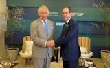 Britain's King Charles III (left) shakes hands with President Isaac Herzog on the sidelines of the COP28 summit in Dubai, December 1, 2023. (Courtesy)