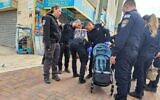Police at the scene where a 2-year-old boy was stabbed to death in Lod, December 28, 2023. (Israel Police)