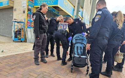 Police at the scene where a 2-year-old boy was stabbed to death in Lod, December 28, 2023. (Israel Police)
