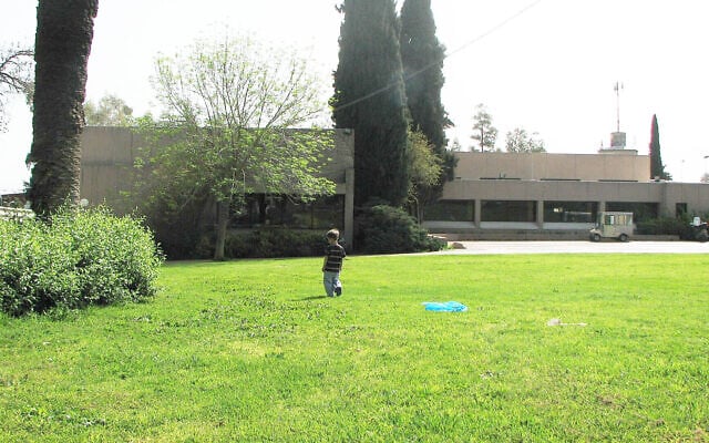 A child plays on the lawned clearing near the cafe of Mishmar Ha'emek on March 23, 2008. (Wikimedia Commons)