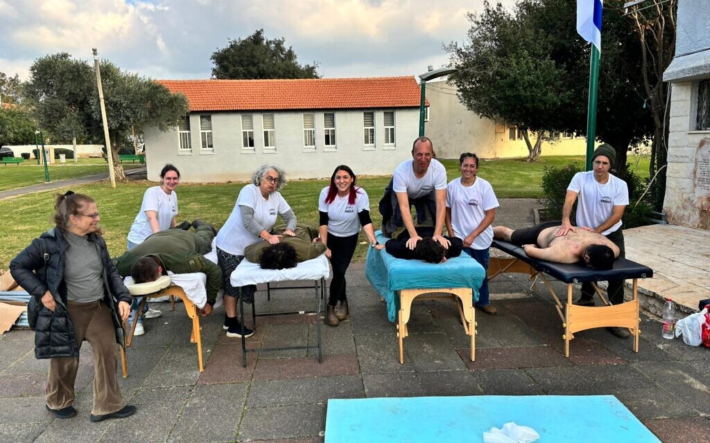 Tasha Cohen, center, with a group pf Chayal's Angels providing therapy to IDF soldiers, December 18, 2023. (Courtesy) Tasha Cohen, center, with a group pf Chayal's Angels providing therapy to IDF soldiers, December 18, 2023. (Courtesy)
