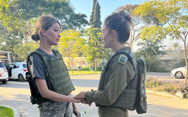 US Congressional candidate Sarah Idan (left), a former Miss Iraq, tours the Hamas-wrought destruction of Kfar Aza, December 28, 2023. (X, used in accordance with Clause 27a of the Copyright Law)