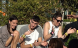 Ofir Engel (middle), pictured a few days after his release from Hamas captivity on November 29, 2023; his girlfriend, Yuval Sharabi, is at left. (Courtesy)