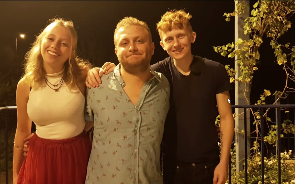 Yotam Haim, right, with his siblings before he was taken captive by Hamas terrorists on October 7, 2023 to Gaza (Courtesy)