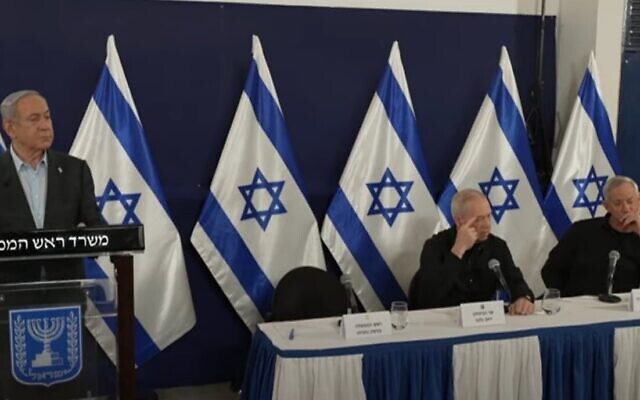 Prime Minister Benjamin Netanyahu (left), Defense Minister Yoav Gallant (center) and Minister Benny Gantz deliver remarks on December 5, 2023. (Screen capture: PMO) Prime Minister Benjamin Netanyahu (left), Defense Minister Yoav Gallant (center) and Minister Benny Gantz deliver remarks on December 5, 2023. (Screen capture: PMO)