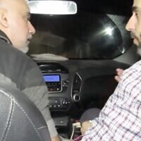 A screenshot of an undated video released by the Israel Defense Forces on December 17, 2023, shows Hamas commander Muhammad Sinwar, right, riding in a car traveling through a tunnel under the Gaza Strip. (Screenshot: Israel Defense Forces)