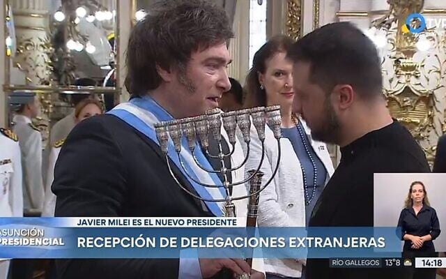 Argentina's Javier Milei hands a Hanukkah menorah to Ukraine's Volodymyr Zelensky during Milei's inaugural ceremonies in Buenos Aires, Dec. 10, 2023. (Screenshot from Argentinean national TV broadcast via JTA) Argentina's Javier Milei hands a Hanukkah menorah to Ukraine's Volodymyr Zelensky during Milei's inaugural ceremonies in Buenos Aires, Dec. 10, 2023. (Screenshot from Argentinean national TV broadcast via JTA)