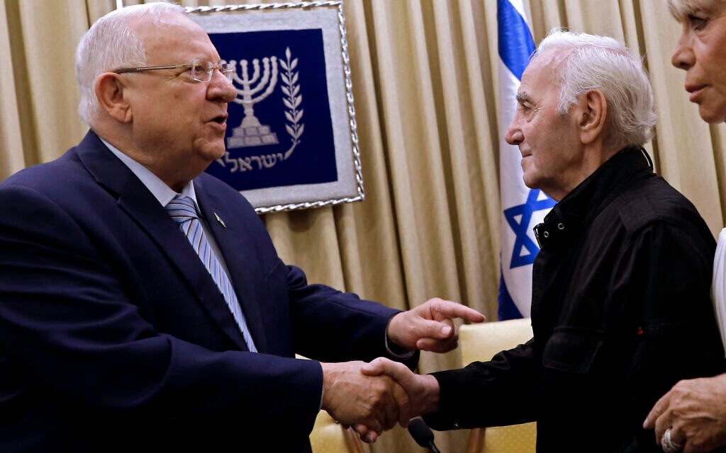 Former Israeli president Reuven Rivlin, left, shakes hands with French-Armenian singer Charles Aznavour on October 26, 2017 at the presidential compound in Jerusalem. (GALI TIBBON/AFP) Former Israeli president Reuven Rivlin, left, shakes hands with French-Armenian singer Charles Aznavour on October 26, 2017 at the presidential compound in Jerusalem. (GALI TIBBON/AFP)