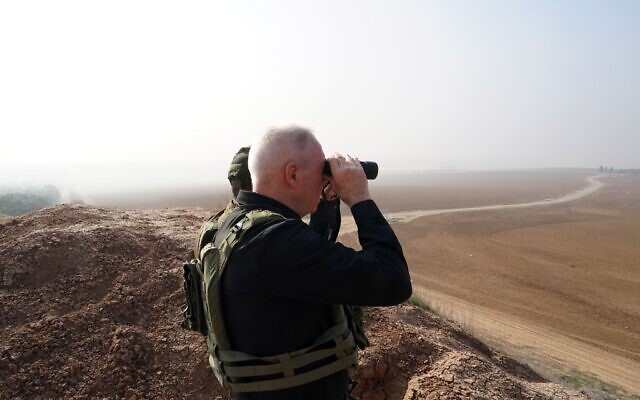 Defense Minister Yoav Gallant observes the northern Gaza Strip from the border, December 4, 2023. (Ariel Hermoni/Defense Ministry) Defense Minister Yoav Gallant observes the northern Gaza Strip from the border, December 4, 2023. (Ariel Hermoni/Defense Ministry)