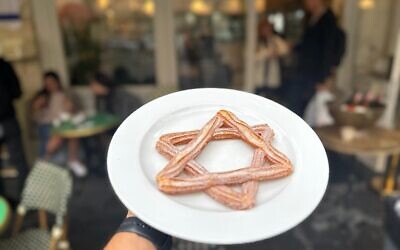 A patriotic churros created for Hanukkah 2023 by Jerusalem's Kadosh bakery (Courtesy)
