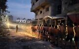 Palestinian men surrender to troops in northern Gaza's Jabaliya, on December 10, 2023. (Social media; used in accordance with Clause 27a of the Copyright Law)